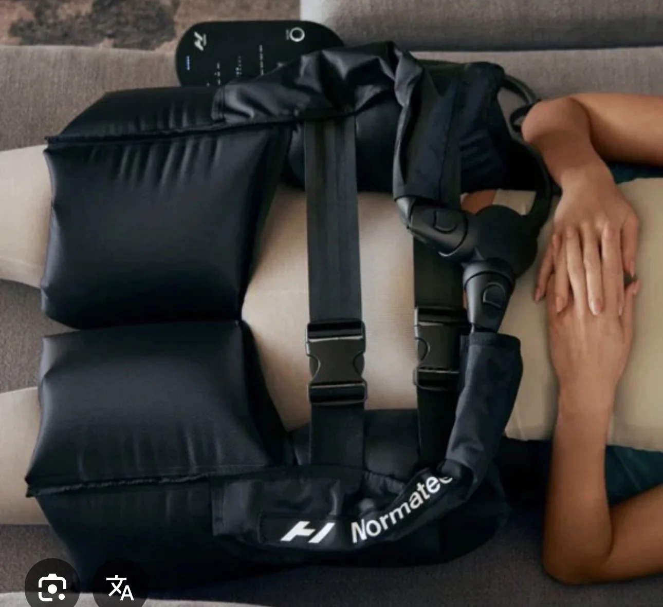 NormaTec hip compression attachment in use during a seated session