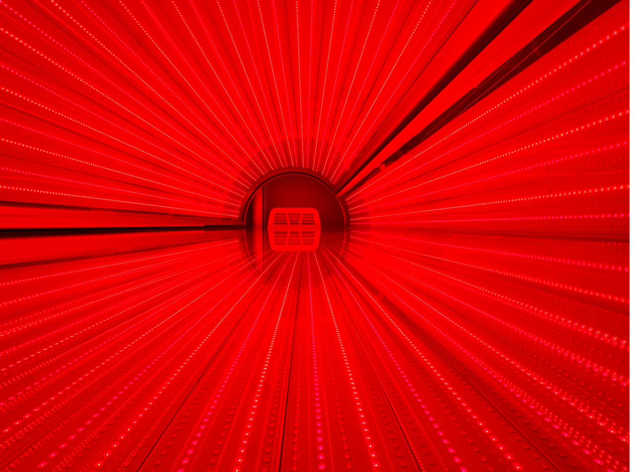 Full-body red light therapy bed at Naturally Bronzed Wellness Studio, Great Neck NY